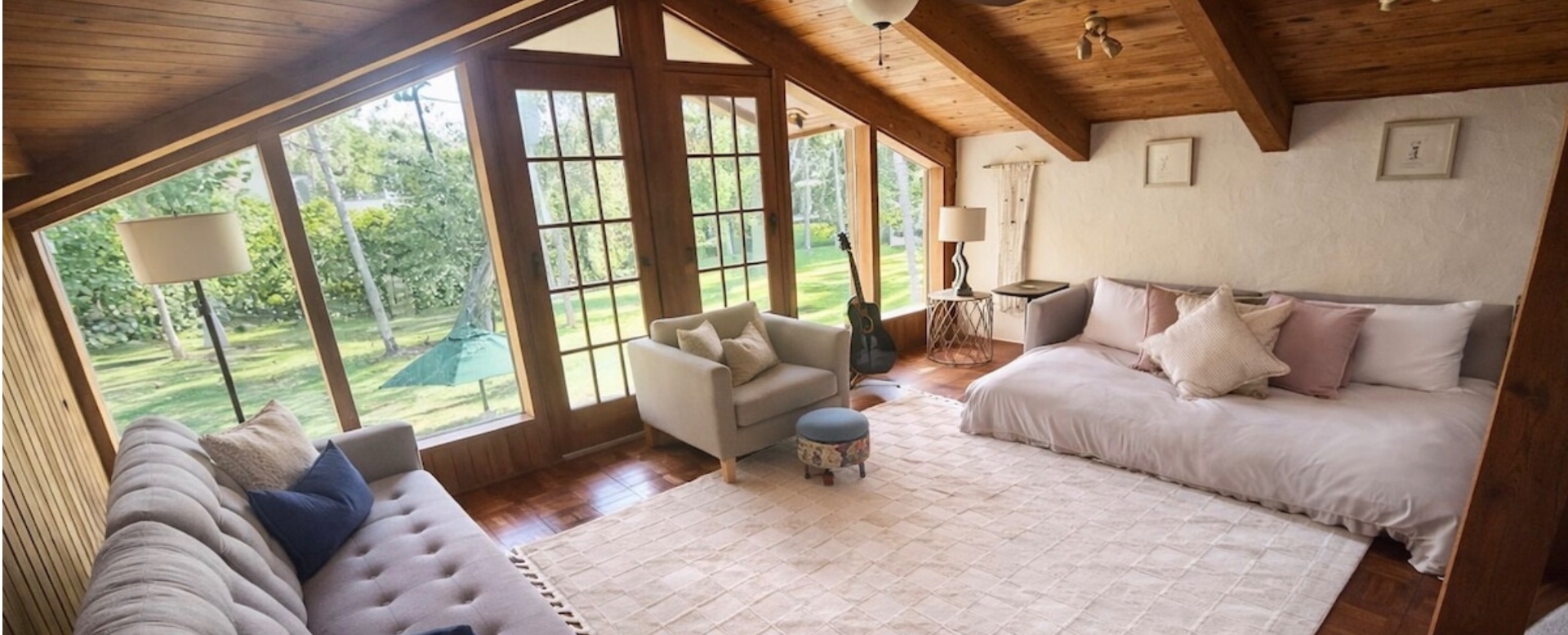 Garden Sunroom — Floor-to-ceiling windows overlooking the back lawn